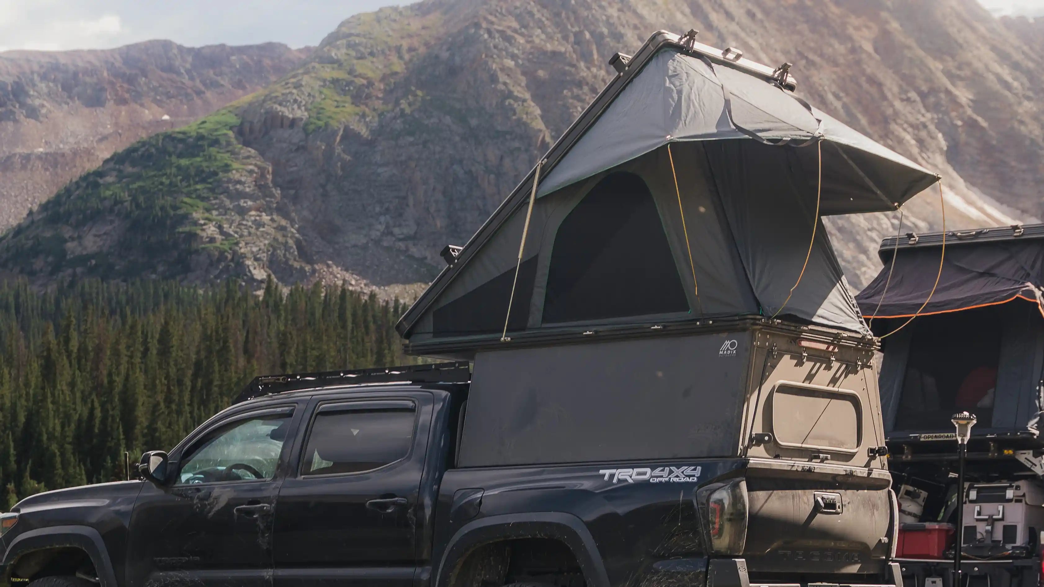 Toyota Tacoma with aluminum truck bed camper and pop up tent