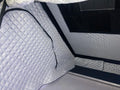 Quilted gray thermal liner inside rooftop tent.